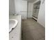Bathroom featuring a vanity with sink, toilet, and bathtub with tile flooring at 703 E Hamilton Ave, Tampa, FL 33604