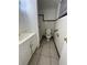 A bathroom featuring a walk-in shower, toilet, vanity sink and tile flooring at 703 E Hamilton Ave, Tampa, FL 33604