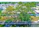 Overhead shot showcasing the beautiful mature trees and canal running behind the property at 7081 Lafayette N, Pinellas Park, FL 33781