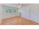 Comfortable bedroom with wood floors and convenient access to the en-suite bathroom at 7081 Lafayette N, Pinellas Park, FL 33781