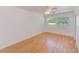 Inviting bedroom featuring wood floors, a ceiling fan, and ample natural light at 7081 Lafayette N, Pinellas Park, FL 33781
