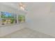 Bright bedroom with tile floors and a ceiling fan offering a refreshing breeze at 7081 Lafayette N, Pinellas Park, FL 33781