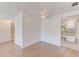 Inviting living room with views of the kitchen, showcasing seamless flooring and natural light at 7081 Lafayette N, Pinellas Park, FL 33781