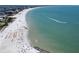 Scenic aerial view of a bustling beach and tranquil ocean at 7100 Sunset Way # 303, St Pete Beach, FL 33706