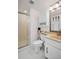 Clean, well-maintained bathroom with tile floor and shower stall at 7100 Sunset Way # 303, St Pete Beach, FL 33706