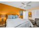 Bedroom with ensuite featuring comfortable king bed and blue accents at 7100 Sunset Way # 303, St Pete Beach, FL 33706