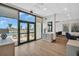 Bright community entrance with large windows that look out onto the pool and beach, as well as comfortable seating at 7100 Sunset Way # 303, St Pete Beach, FL 33706