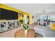 Living room view with open floor plan, television, and views of the ocean at 7100 Sunset Way # 303, St Pete Beach, FL 33706