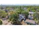 This aerial view reveals a well-kept home nestled among lush trees within a peaceful neighborhood setting at 7210 8Th N Ave, St Petersburg, FL 33710