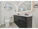 Well-lit bathroom with dual vanity, and a toilet adjacent to the vanity at 7210 8Th N Ave, St Petersburg, FL 33710