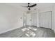Bedroom with light hardwood floors and a ceiling fan at 7210 8Th N Ave, St Petersburg, FL 33710