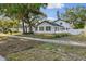 Beautiful two-story home featuring an immaculate white exterior and a well-manicured lawn at 7210 8Th N Ave, St Petersburg, FL 33710