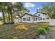 Stunning two-story home featuring an immaculate white exterior and well-manicured lawn at 7210 8Th N Ave, St Petersburg, FL 33710