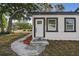 Charming home featuring a stylish front entrance and well-maintained landscaping at 7210 8Th N Ave, St Petersburg, FL 33710