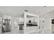 Open kitchen layout with granite countertops and stainless steel appliances at 7210 8Th N Ave, St Petersburg, FL 33710