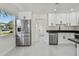 Bright kitchen with stainless steel appliances, including refrigerator and dishwasher at 7210 8Th N Ave, St Petersburg, FL 33710