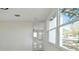 Sunlit living area showcasing an open layout and sleek tiled floors at 7210 8Th N Ave, St Petersburg, FL 33710