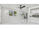 Bright living space with a ceiling fan and sleek tile flooring at 7210 8Th N Ave, St Petersburg, FL 33710