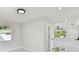 Bright living room showcasing modern lighting, neutral walls, and contemporary flooring at 7210 8Th N Ave, St Petersburg, FL 33710