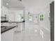 Open floor plan featuring a kitchen, dining, and living area with natural light at 7210 8Th N Ave, St Petersburg, FL 33710