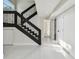 Staircase featuring dark wood accents and ample natural light at 7210 8Th N Ave, St Petersburg, FL 33710