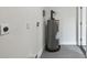 Utility area with gray water heater, a plug and basic finishes at 7210 8Th N Ave, St Petersburg, FL 33710