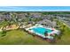 An aerial view showcases the community pool, playground, clubhouse, and green spaces, emphasizing a Gathering-friendly lifestyle at 7331 Canterbury Bells Ct, Tampa, FL 33619