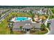 Aerial view showcasing community amenities including a pool, playground, clubhouse, and surrounding residences at 7331 Canterbury Bells Ct, Tampa, FL 33619