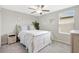 Bright bedroom with a bed, dresser, and natural light creating a comfortable space at 7331 Canterbury Bells Ct, Tampa, FL 33619
