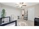 Bright Bedroom with a crib, comfortable chair, and ladder bookshelf creating a cozy atmosphere at 7331 Canterbury Bells Ct, Tampa, FL 33619