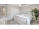 Cozy bedroom with a bed, dresser, and natural light creating a relaxing atmosphere at 7331 Canterbury Bells Ct, Tampa, FL 33619