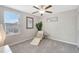 Comfortable bedroom with natural light, ceiling fan, lounge chair and serene ambiance at 7331 Canterbury Bells Ct, Tampa, FL 33619