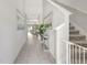 Bright foyer with staircase, tiled flooring, and an open floor plan leading to the living areas at 7331 Canterbury Bells Ct, Tampa, FL 33619