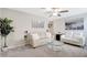 Open-concept living room with sleek furniture, modern decor, and lots of room for relaxation at 7331 Canterbury Bells Ct, Tampa, FL 33619