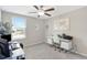 Bright office space with a modern desk setup and ample natural light from the large window at 7331 Canterbury Bells Ct, Tampa, FL 33619