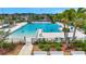 A resort-style pool offers ample space for swimming and sunbathing within a well-maintained community at 7331 Canterbury Bells Ct, Tampa, FL 33619