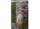Aerial view of the property showing the boundaries, buildings, and ample land surrounded by trees at 9802 Eden Ave, Hudson, FL 34667