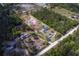 Aerial view of a property with an outlined property line and a mix of wooded areas and open spaces at 9802 Eden Ave, Hudson, FL 34667