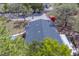 Well-maintained roof of this single-story home, surrounded by mature trees at 9802 Eden Ave, Hudson, FL 34667