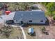 Charming single-story home with a well-maintained roof and lush surroundings at 9802 Eden Ave, Hudson, FL 34667