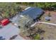 Single-story home nestled in a tree-filled landscape at 9802 Eden Ave, Hudson, FL 34667