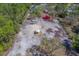 Vast aerial shot of the property showcasing the layout and surrounding lush greenery at 9802 Eden Ave, Hudson, FL 34667