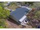 Single-story home with a backyard patio and hot tub at 9802 Eden Ave, Hudson, FL 34667