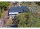 Single-story home with a screened-in porch and spacious backyard at 9802 Eden Ave, Hudson, FL 34667