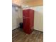 Retro-style GALANZ brand refrigerator with black trash can at 9802 Eden Ave, Hudson, FL 34667