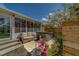 Outdoor patio area featuring a hot tub and comfortable seating for relaxation and entertaining at 9802 Eden Ave, Hudson, FL 34667
