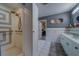 Bathroom featuring a walk-in shower, vanity, and neutral tones throughout at 9802 Eden Ave, Hudson, FL 34667