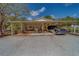 Spacious covered parking area with a black car parked inside at 9802 Eden Ave, Hudson, FL 34667