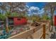 View of shed, lot, trees, and side yard fenced area at 9802 Eden Ave, Hudson, FL 34667