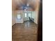 Spacious room with wood flooring and upstairs loft area at 9802 Eden Ave, Hudson, FL 34667